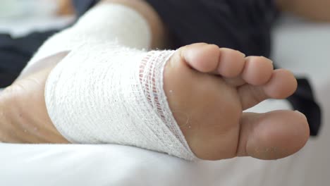 woman with bandaged foot close up ,