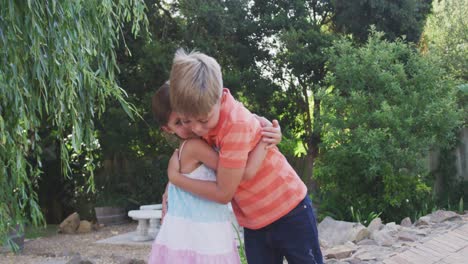 children hugging each other in the garden