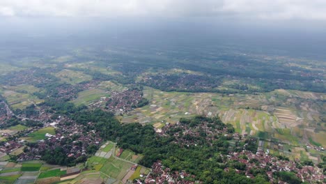 small villages and rice fields in indonesia, high altitude drone view