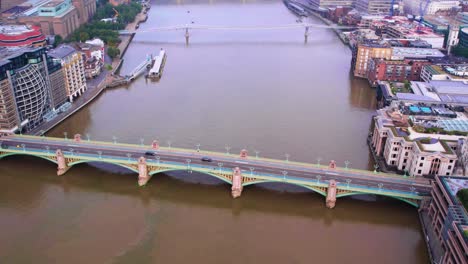 aerial - southwark bridge and the river thames, london, england, wide forward shot