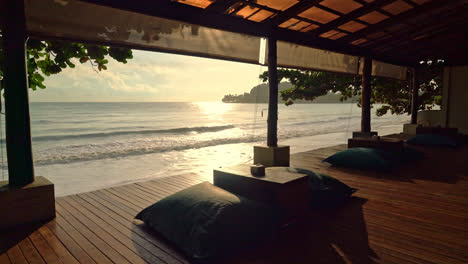 bean bag on balcony with sea beach background at sunrise or sunset time