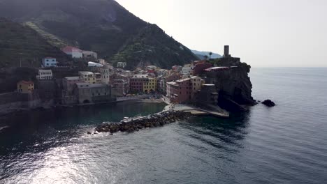 Enchanting-Cinque-Terre:-Aerial-view-of-Vernazza-harbor-and-vineyards