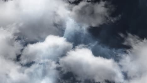 thunderstorm in dark clouds with white clouds foreground