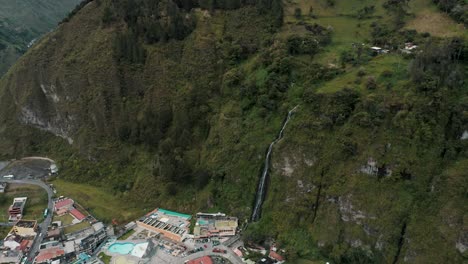 stunning cascada de la virgen flowing down the mountain cliff at baños de agua santa, ecuador