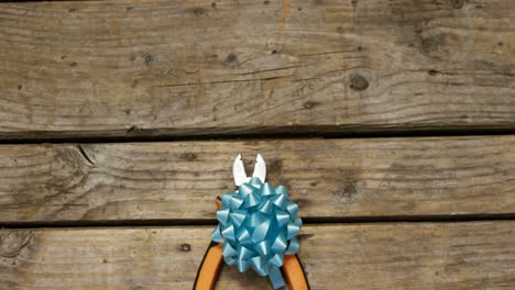 Decorated-pliers-on-wooden-plank