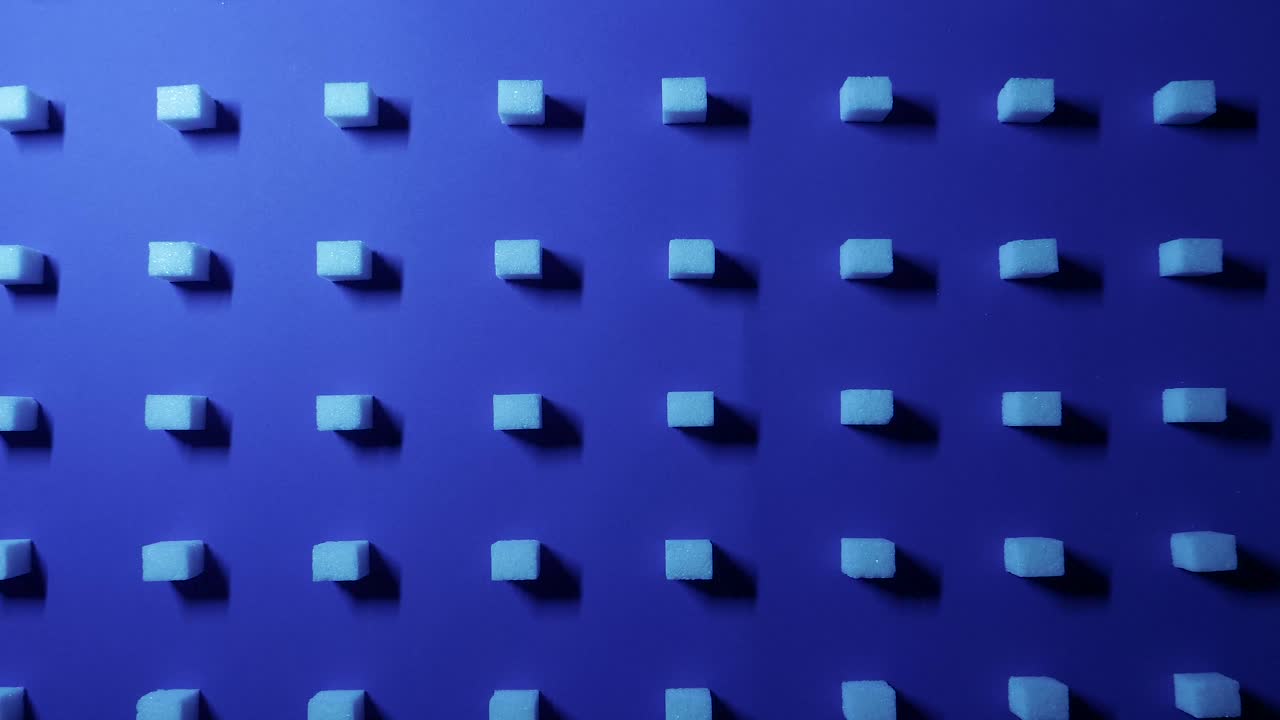 un zoom en vista de un fondo cúbico único de 4k con cubos de azúcar blanco dispuestos en filas sobre un fondo azul oscuro, efecto 3d