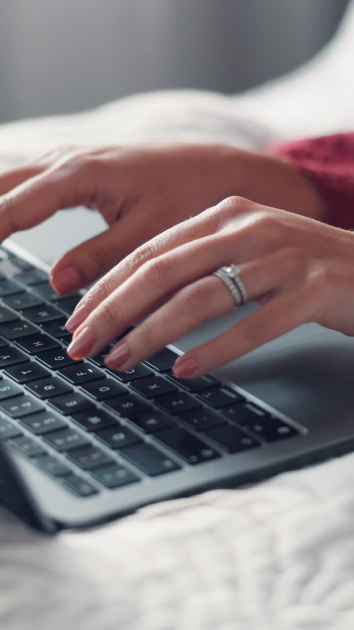 Close-Up of Woman's Hands Typing on Laptop Keyboard