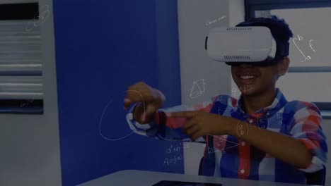Mathematical-equations-floating-against-african-american-boy-wearing-vr-headset-at-elementary-school