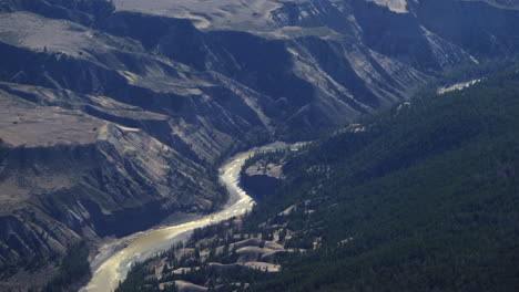 fraser river with scenic mountain range near williams lake city in british columbia, canada