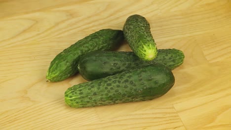 cucumbers rotate on a wooden background