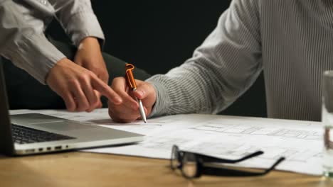 Man-and-woman-checking-plans-together