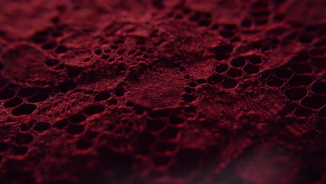 Close-up-shot-of-red-textiles-fabric-with-lace-and-interesting-patterns