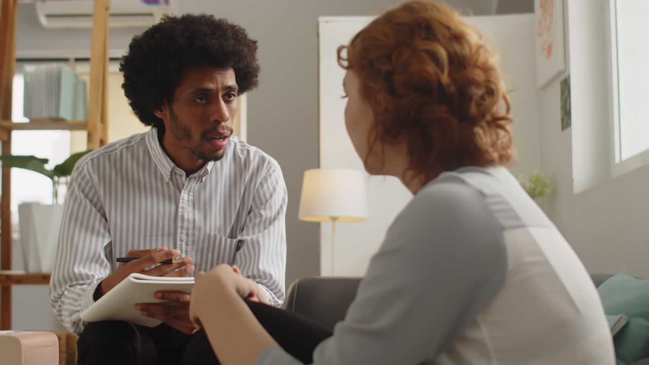 Therapist Examining Mental Health of Young Woman at Psychological Session