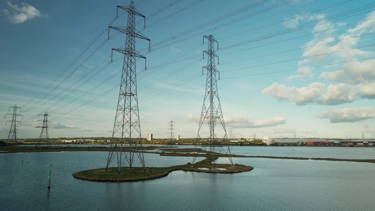 High Voltage Transmission Towers At Eling Great Marsh Along River Test In Southampton, United Kingdom