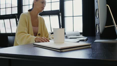 woman working at home office desk