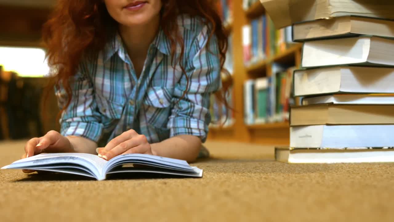 Student reading a library book