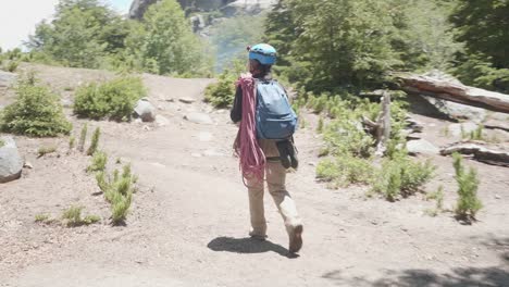 climber walking in the forest with his rope