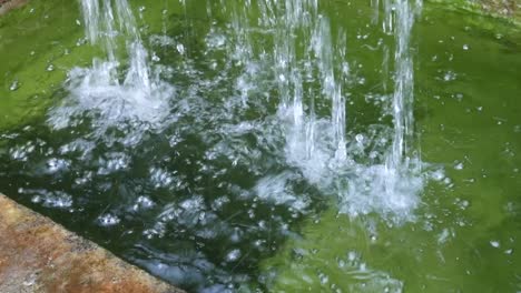 artificial waterfall in a pond