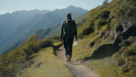 man hiking on a mountain trail