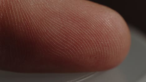 detailed macro of fingerprint on index finger