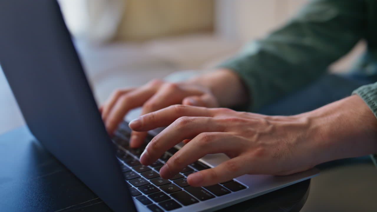 Businessman fingers typing keyboard laptop office closeup. Smiling guy working