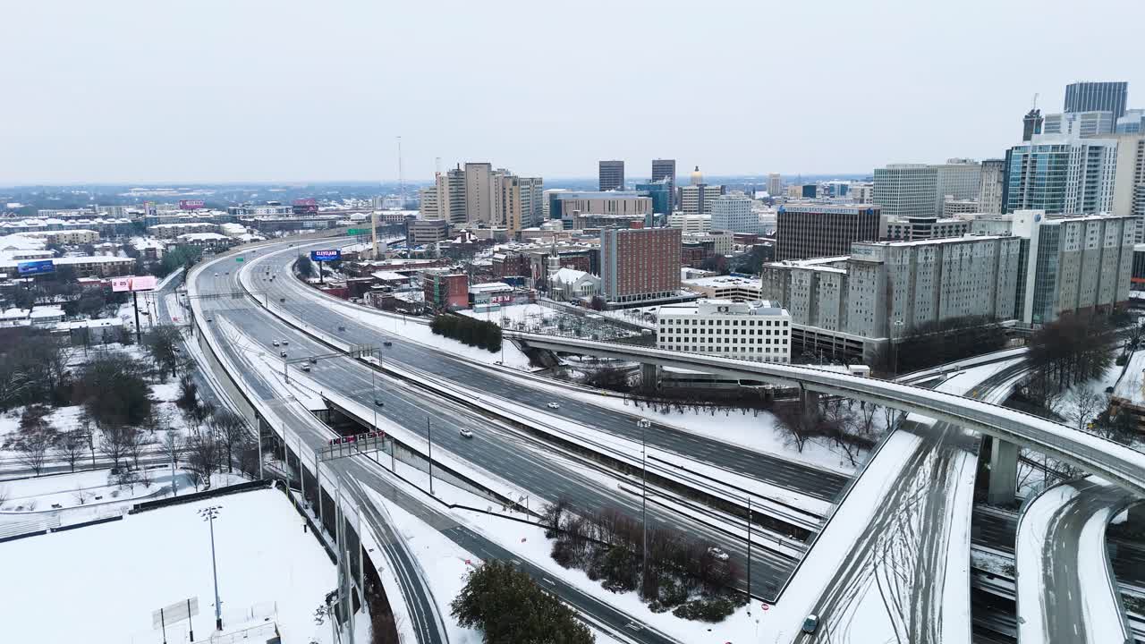 Static aerial shot of snow covered interstate 75-85 South in Downtown Atlanta Georgia on January 10th 2025.
