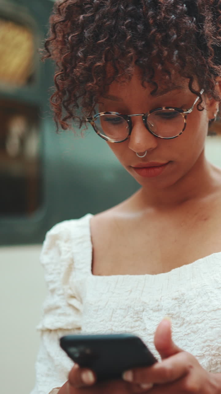 Portrait of a woman with eyeglasses and a nose ring