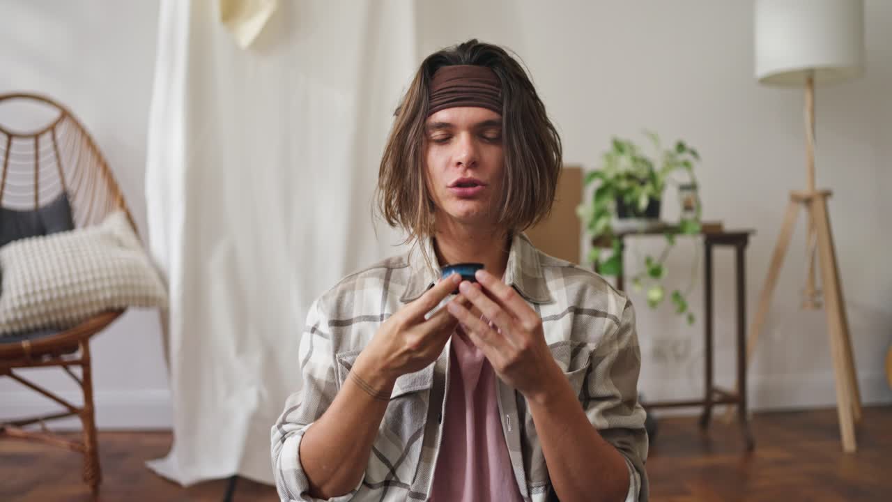 Man enjoying a drink at home