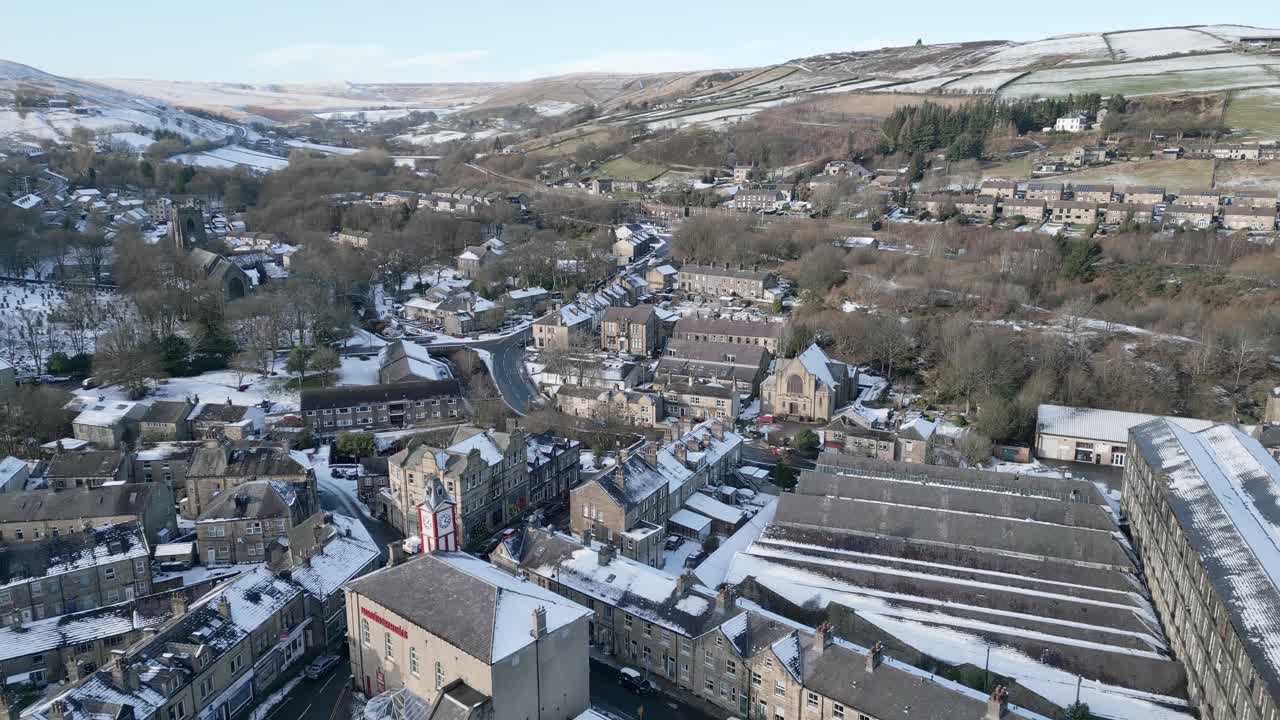 Cold winter Cinematic Cityscape Townscape with snow covered roof tops Panorama 4K Marsden Village West Yorkshire, Endland