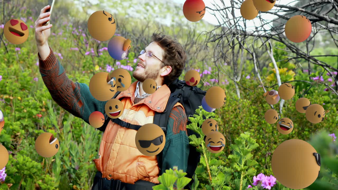 배경 4k에서 셀카를 찍는 남자와 함께 이모지 아이콘