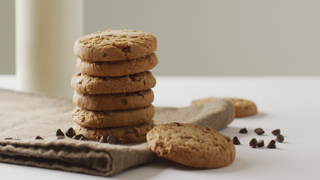 Video of biscuits with chocolate and milk on white background