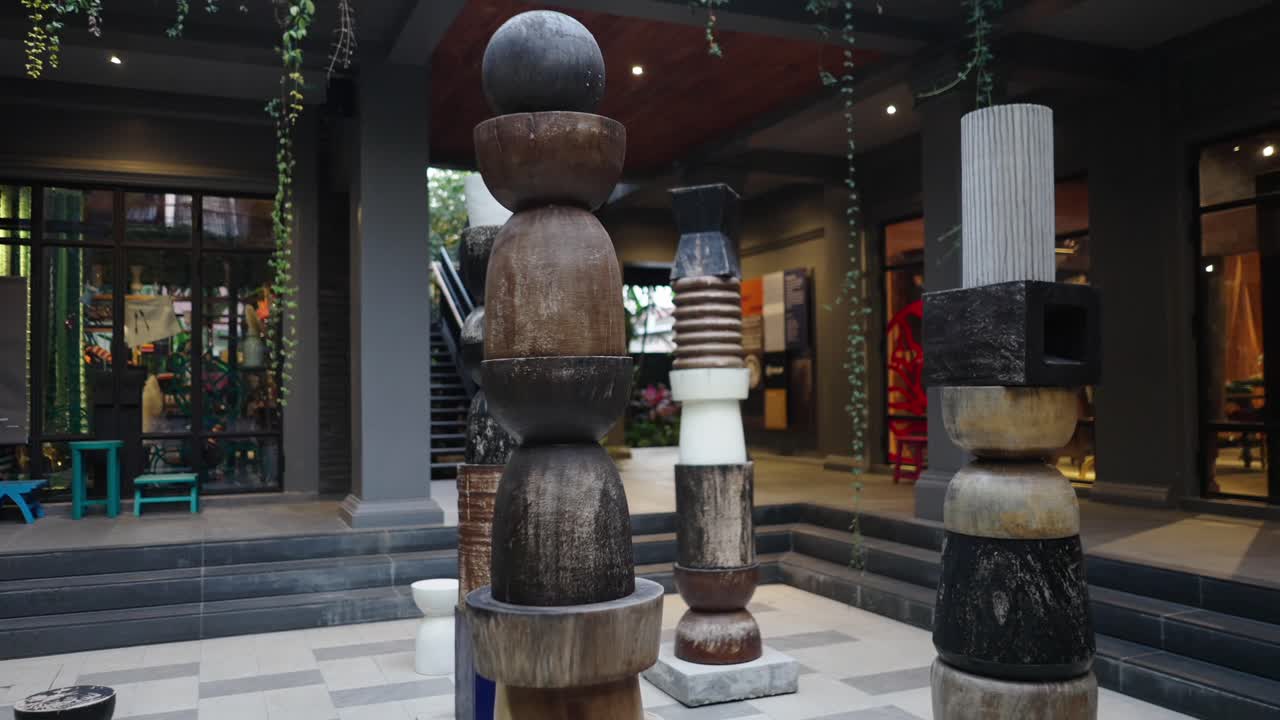 Outdoor Art Installation Featuring Stacked Wooden Sculptures