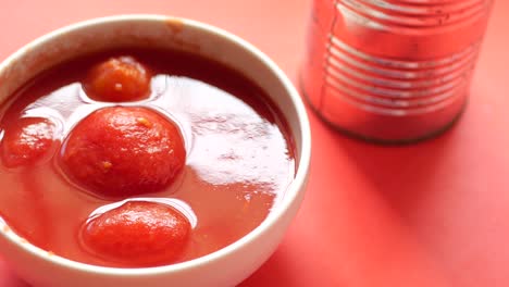 canned tomatoes in a white bowl