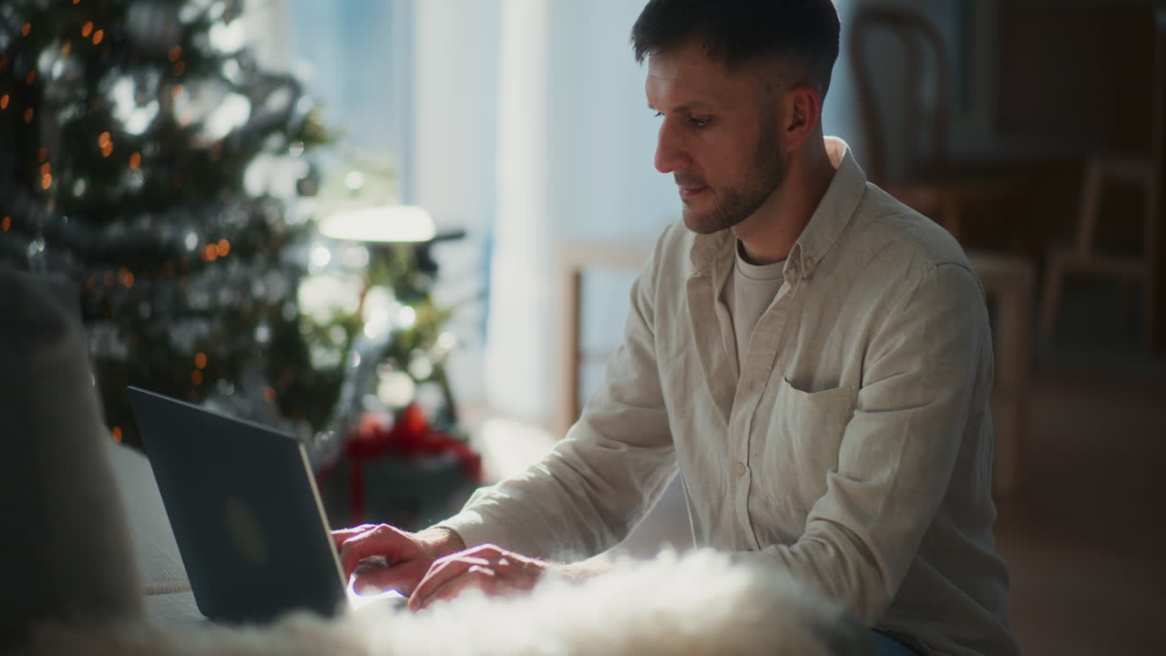 Silhouette Of Man Working On Laptop Works Remotely During Christmas
