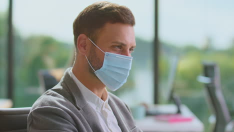 business person working in office during pandemic