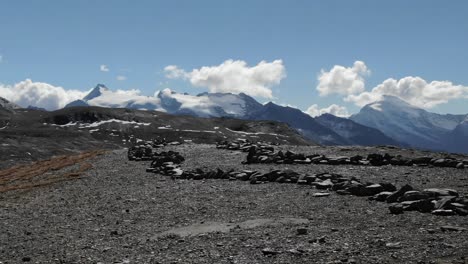 drone taking off from top rocky mountain with beautiful landscape in background