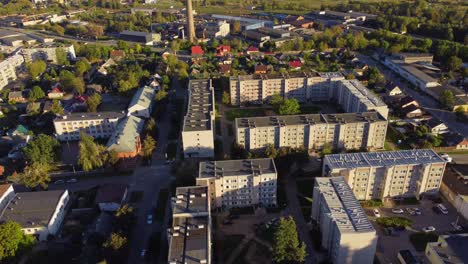 aerial view of residential block buildings in urban neighborhood with green spaces