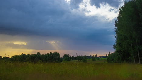 Fast-moving-Clouds-time-lapse-over-a-grassland-landscape-during-sunset