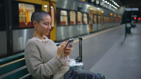 woman waiting at train station