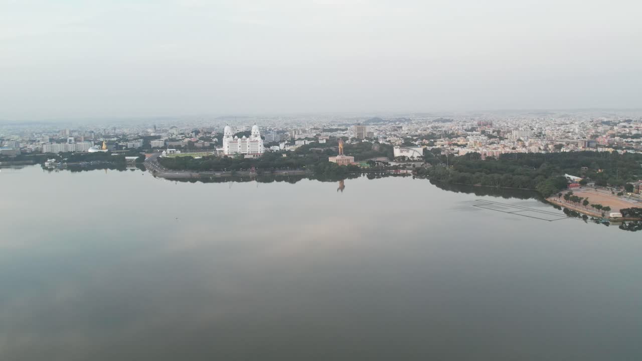 Aerial view of the Hussain Sagar Lake in Hyderabad, the Telangana Secretariat, and the Martyrs Memorial, which is home to the world's largest, 125-foot-tall DR