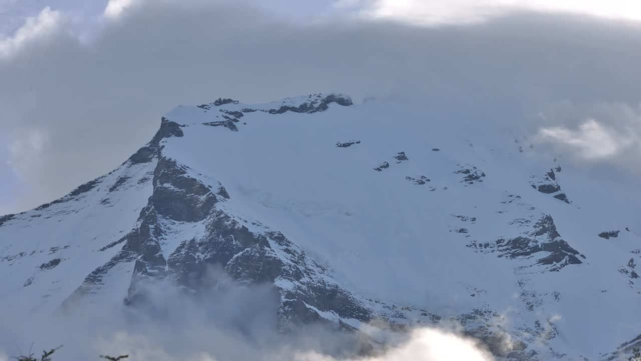 Time lapse of a snow capped mountain summit and cloudscape, in Patagonia, Chile