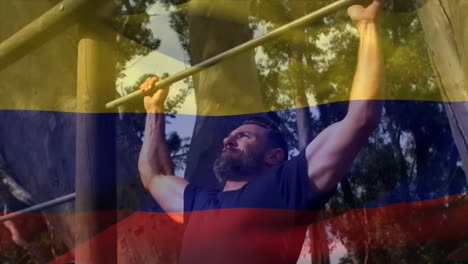 animación de la bandera ir a colombia sobre hombre musculoso fuerte haciendo pull ups