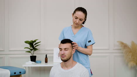 man receiving a head massage