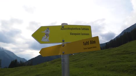 tuftl alm sign on trail in austrian alps orbit motion