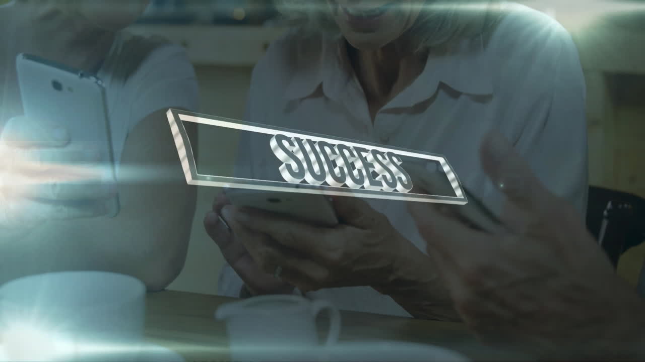 Success text animation over people discussing at table with coffee cups