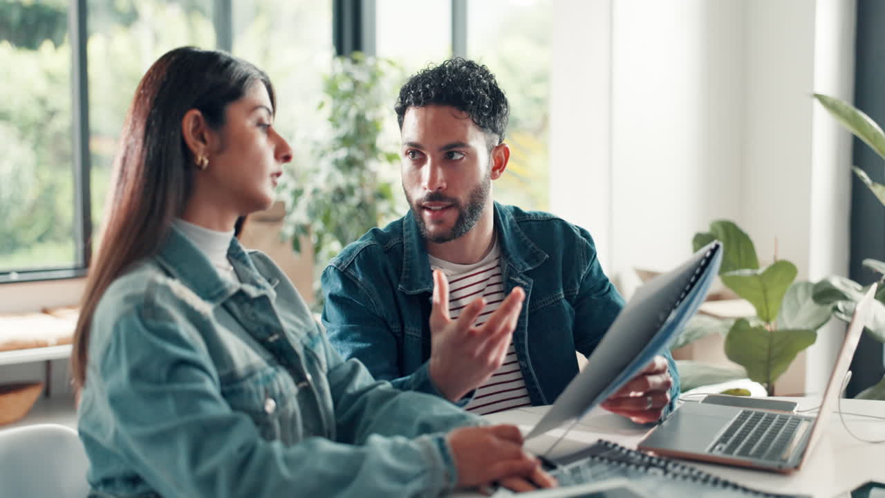 Couple working together at desk