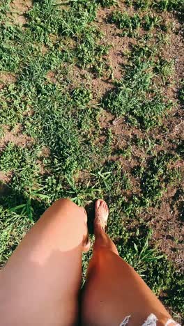woman walking through grass