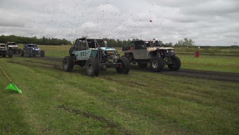 video of two all terrain cars istarting a race