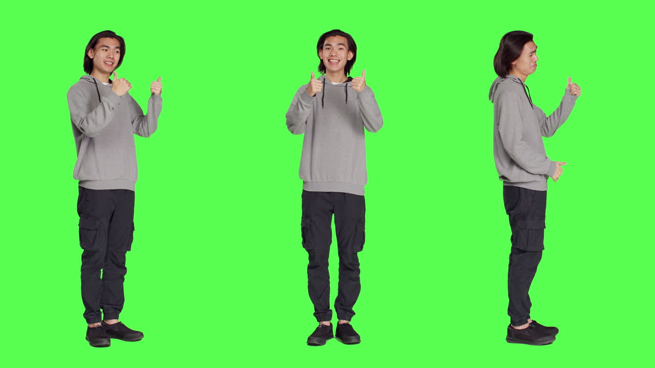 아시아 남자가 엄지손가락을 들고 움직입니다.