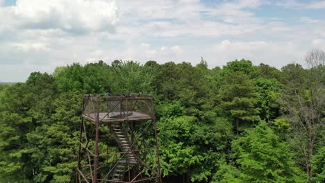 area viewpoint tower of majestic forestry landscape in close by drone view